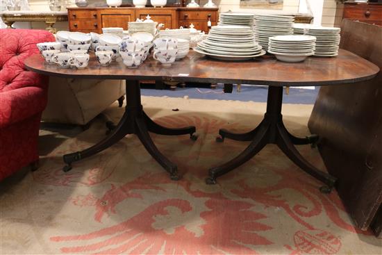 A George III mahogany twin pillar dining table, circa 1800, extends to 12ft 3in. x 5ft 2.5in.